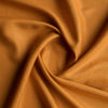 Saturated golden ochre 100% linen fabric with a luxurious smooth finish