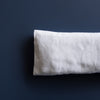 Handmade White Linen Eye Pillow made in Australia, filled with Organic Australian Golden Linseed and optional Organic Lavender Flowers. Includes a removable and washable 100% linen cover, ideal for yoga, meditation, and stress relief. Size: 22cm x 10cm, weight: 210-220g.