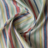 Harbour Carnival linen–cotton fabric with multi-colour yarn-dyed stripes in navy, red, yellow, aqua and green on white, 145 GSM, 44 LEA