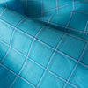 Soft and smooth Pop of Blue Plaid 100% Linen Fabric, featuring a balanced check pattern in aqua, royal blue, and white, ideal for dressmaking and napery