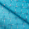 Soft and smooth Pop of Blue Plaid 100% Linen Fabric, featuring a balanced check pattern in aqua, royal blue, and white, ideal for dressmaking and napery