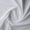 Pure White with Ivory Dot Giza Cotton Blend Fabric with small ivory embroidered dots on a white base