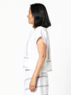 Quinn Woven Top sewing pattern with square cut, extended shoulder line, boxy shape, and front and back panelling.