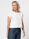 Quinn Woven Top sewing pattern with square cut, extended shoulder line, boxy shape, and front and back panelling.