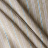 Close-up of striped Seagrass Pinstripe linen fabric with pale sage-beige base, light-brown pinstripes, white and blue accents, 100% linen, 130 GSM, 60 LEA