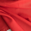 Vibrant Shocking Red linen fabric with a smooth texture and medium drape, ideal for crafting statement fashion pieces.