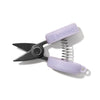Small pair of scissors with purple handles on a white background