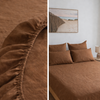 Tobacco brown linen fitted sheet on a bed with a close-up detail, and a bedroom setting with the bedspread.