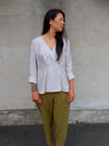 Style Arc’s Vera Woven Blouse pattern with feminine wrap front, pleats, and long sleeves.