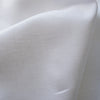 Mid to heavyweight White Zephyr 100% Linen Fabric, smooth with a medium drape and slight natural slubs, ideal for timeless wardrobe pieces.