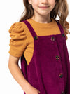 Style Arc’s Zoe Kids Pinafore pattern with button-through front and adjustable shoulder straps.