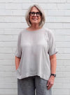 Stylish Betty Woven Tunic sewing pattern with a modern square shape, extended shoulders, and side splits, suitable for crepe, silk, and rayon fabrics