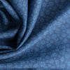 “Classic Blue Print Flower Linen Fabric with light blue floral design on dark background.