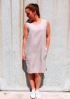 Iris Woven Dress sewing pattern, showcasing a stylish shift dress with a slight cocoon shape, large pockets, and customizable bias band finishes, suitable for linen, crepe, rayon, and cotton fabrics.