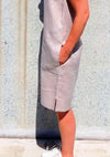 Iris Woven Dress sewing pattern, showcasing a stylish shift dress with a slight cocoon shape, large pockets, and customizable bias band finishes, suitable for linen, crepe, rayon, and cotton fabrics.