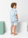 Kids’ Rhys Overshirt sewing pattern with button front, collar, short sleeves, and breast pocket, perfect for cotton or linen fabrics