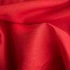 Fiery Scarlet linen fabric with a lightweight texture, offering timeless elegance and versatility for fashion design.